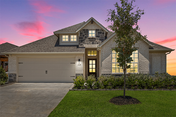 Coppell model home exterior with brick and stone facade in Aubrey TX